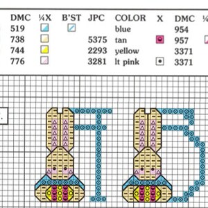 May include: A cross-stitch pattern chart labeled 57 featuring two bunny figures on a grid. The legend lists DMC thread colors including blue 519, tan 738, yellow 744, light pink 776, 954, 957, and 3371. The bunnies are tan with blue accents and pink cheeks.