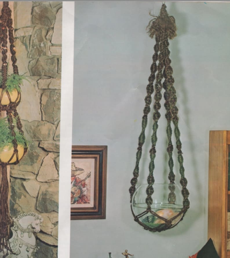 May include: A macrame plant hanger with a clear glass bowl. The hanger is made of brown and green rope, and the bowl is filled with water and decorative elements. The hanger is suspended from the ceiling.