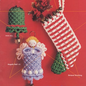 May include: A set of three crocheted Christmas ornaments: a green bell, a purple angel with a wooden face, and a red and white striped stocking. The ornaments are on a red background with a holly sprig.