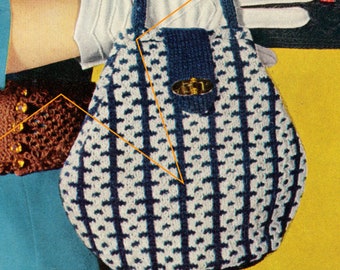 May include: A white and blue crocheted handbag with a blue knitted flap and a gold metal clasp.