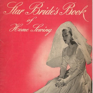 May include: A vintage book cover with a bride in a white dress and veil. The cover is red and features the text "Star Bride's Book of Home Sewing" and "Book 29, 10 Cents".