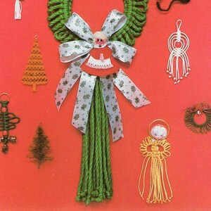 May include: A collection of handmade Christmas ornaments made with green, white, and yellow yarn. The ornaments include a Christmas tree, a bell, a wreath, and an angel. The ornaments are displayed on a red background.