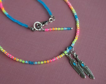 two feathers: matte aqua blue and neon ombre beaded necklace with silver feather charms! neon ombre seed bead feather charm necklace