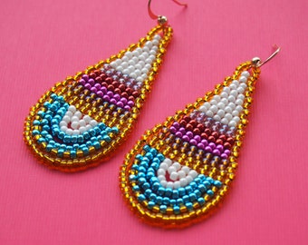 carefree at sea beaded teardrop earrings. multicolor Toho seed bead earrings. gold, reds, pinks, and aqua earrings. lightweight and colorful