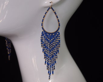 transparent cobalt blue and gold chevron striped beaded fringe earrings on golden teardrops. teardrop dangles with beaded fringes.