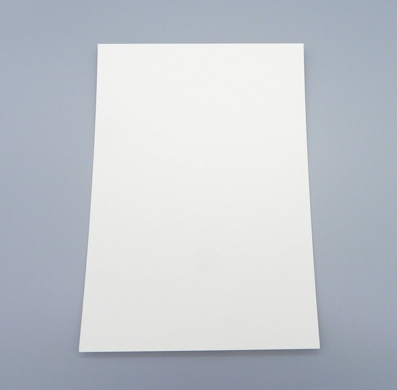 May include: A blank white sheet of paper on a light gray background.