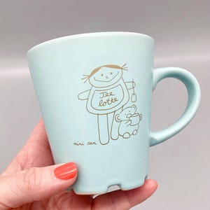 Teacup with handle, Teelotte ceramic cup by nini san / Pastel blue handled cup with matte gold print / Dishwasher safe