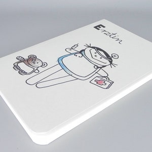 Cuaderno de médico, profesión de médico en boca de los niños