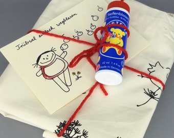 Simply blow away the gloom Set to cheer you up with a jute bag, postcard and soap bubbles