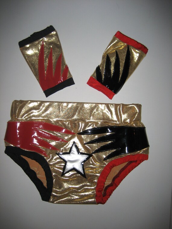 Items similar to Wrestling trunks and wrist covers, gold with red and black spikes on Etsy