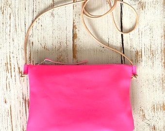 Neon pink leather shoulder bag with leather strap for party or vacation, adjustable length