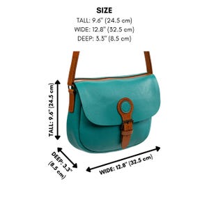 May include: Teal leather crossbody bag with brown leather accents. The bag is 9.6 inches (24.5 cm) tall, 12.8 inches (32.5 cm) wide, and 3.3 inches (8.5 cm) deep. Features a flap closure with a buckle and a brown leather strap.