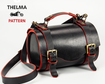 May include: Black leather cylindrical bag with red stitching and brass buckles. The bag has a top handle and a long adjustable shoulder strap.