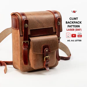 May include: A brown leather backpack with a front pocket, vertical straps, and brass buckles. Text on the right reads: V&P, CLINT BACKPACK PATTERN LASER (DXF), PDF, YouTube icon, DXF icon, A0, A4, LETTER. The design features a structured rectangular shape.