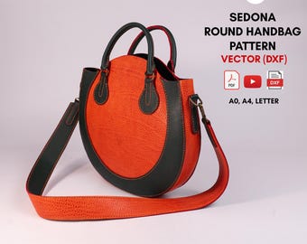 Puede incluir: Un bolso redondo con cuerpo naranja texturizado y ribete verde oscuro, con dos asas superiores y una correa larga para el hombro. El texto dice: V&P SEDONA ROUND HANDBAG PATTERN VECTOR (DXF) PDF A0, A4, LETTER. Iconos de PDF, vídeo y DXF visibles.
