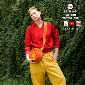 May include: A woman wearing a red jacket and yellow pants is holding a round orange leather bag with a yellow strap. The bag has a flap with a metal buckle. The image is for a digital download of a pattern for a small sling bag.