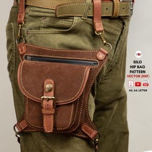 May include: A brown leather hip bag with a flap and buckle closure, attached to a belt and leg strap. The bag has a zippered pocket and is stitched with light-coloured thread. The text "SILO HIP BAG PATTERN VECTOR (DXF)" is visible.