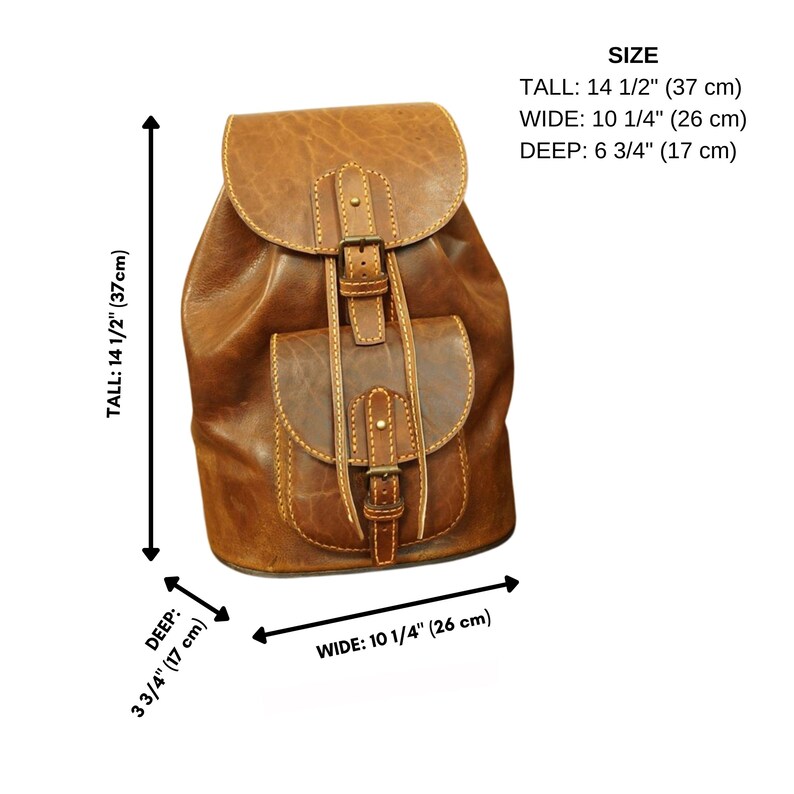 May include: A brown leather backpack with a buckle closure and a front pocket. The backpack measures 14 1/2 inches tall, 10 1/4 inches wide, and 6 3/4 inches deep.