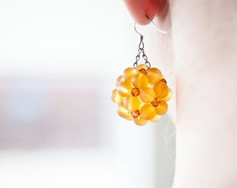 For her round yellow earrings