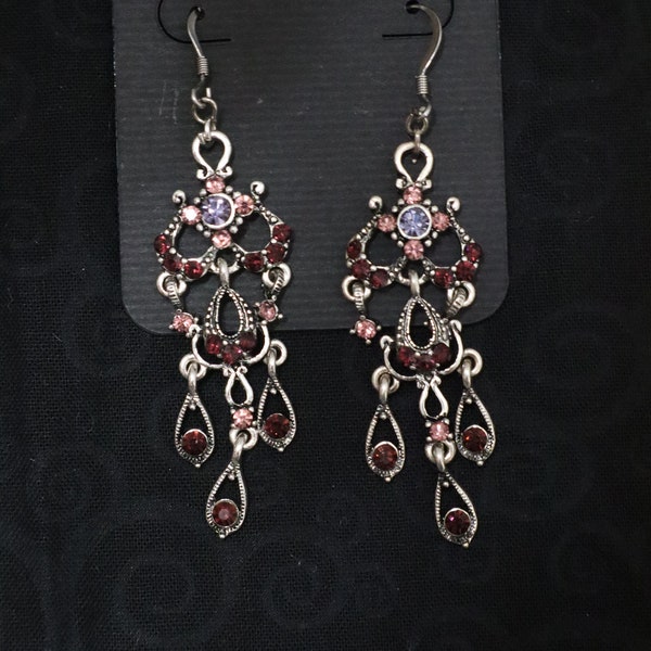 Earrings for sale...A stylish pair of chandelier earrings.  Purple and pink glass beads