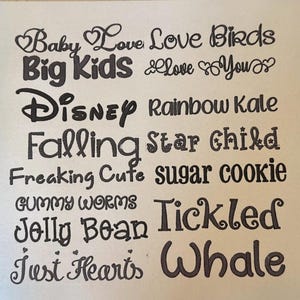 May include: A collection of black text samples in various fonts arranged in two columns. The phrases include Baby Love, Love Birds, Big Kids, Love You, Disney, Rainbow Kale, Falling, Star Child, Freaking Cute, sugar cookie, GUMMY WORMS, Tickled, Jolly Bean, and Just Hearts, Whale.