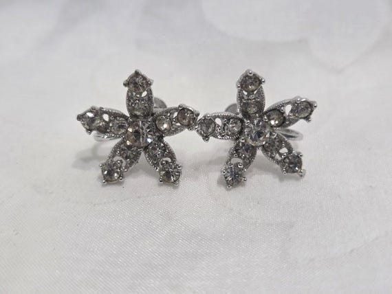 Vintage Bogoff Clear Rhinestone Flower Screw back earrings.