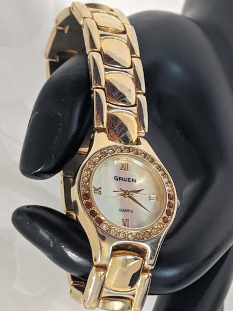 Vintage Gold Tone Women's Gruen Quartz Watch. Round Dial With Rhinestone Gold Tone Bracelet Gruen Vintage Watch. image 4