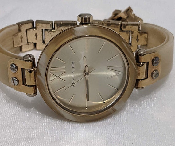 Anne Klein Ladies Horn Plastic Bangle Quartz Round Dial Watch