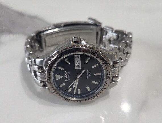 Vintage Seiko Sprots 100 Quartz Men's Wristwatch.  Stainless Steel Bracelet/ Black Dial