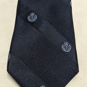 DKNY Navy Men&#39;s Necktie.  DKNY Skinny Solid Navy With Crown Crest Emblems Necktie.