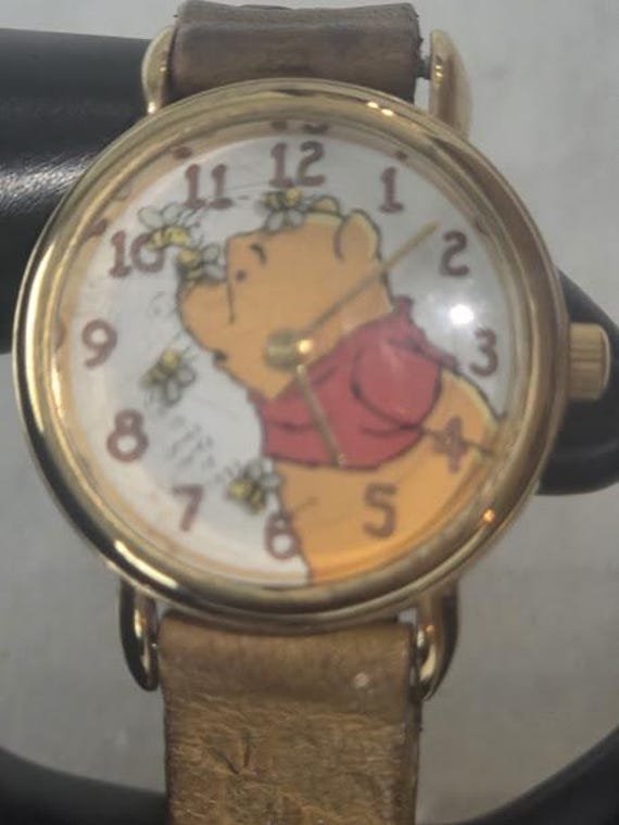 Vintage Winnie the Pooh Women's watch. Winnie the Pooh Wristwatch Gold tone Round with Circling Bumble Bees.