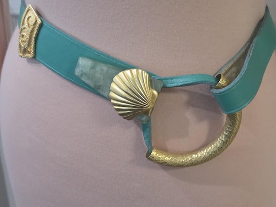 Women's Teal/Green Leather Dress Belt with Gold Tone Buckle and Shell Hardware.
