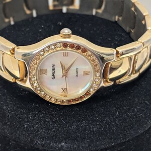 Vintage Gold Tone Women's Gruen Quartz Watch. Round Dial With Rhinestone Gold Tone Bracelet Gruen Vintage Watch. image 6