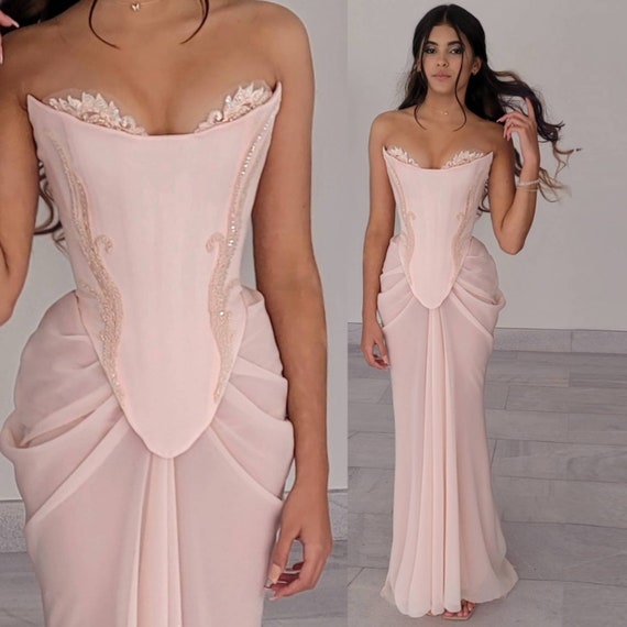 Pink blush silk gown with scoop neckline and feathered hem on Craiyon