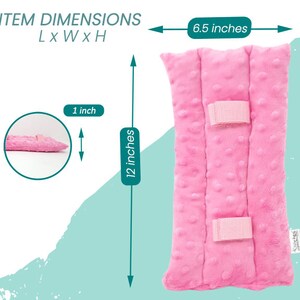 May include: A pink, rectangular plush item with a textured surface and two pink velcro straps. The item is 12 inches long, 6.5 inches wide, and 1 inch thick. The text "ITEM DIMENSIONS" is at the top.