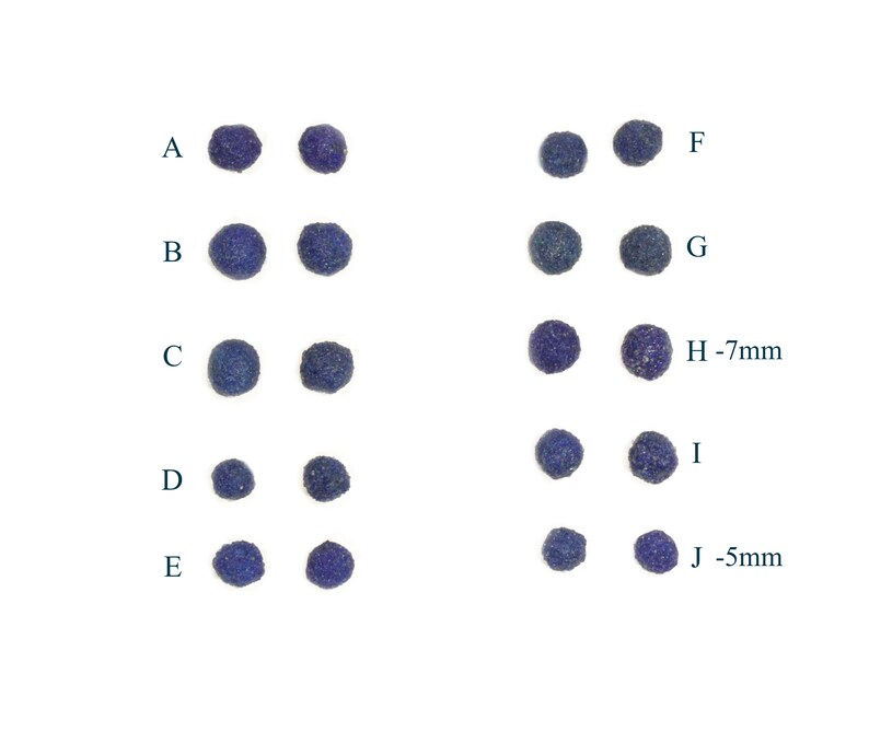 May include: Ten rows of small, round, blue beads. Each row has two beads. The beads are labeled with letters A through J. The beads in rows H and J have measurements of 7mm and 5mm, respectively.