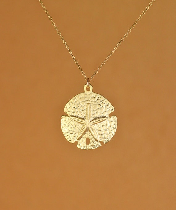 Sand dollar necklace - sea star - beach necklace - starfish necklace - a gold vermeil sand dollar hanging from a 14k gold filled chain