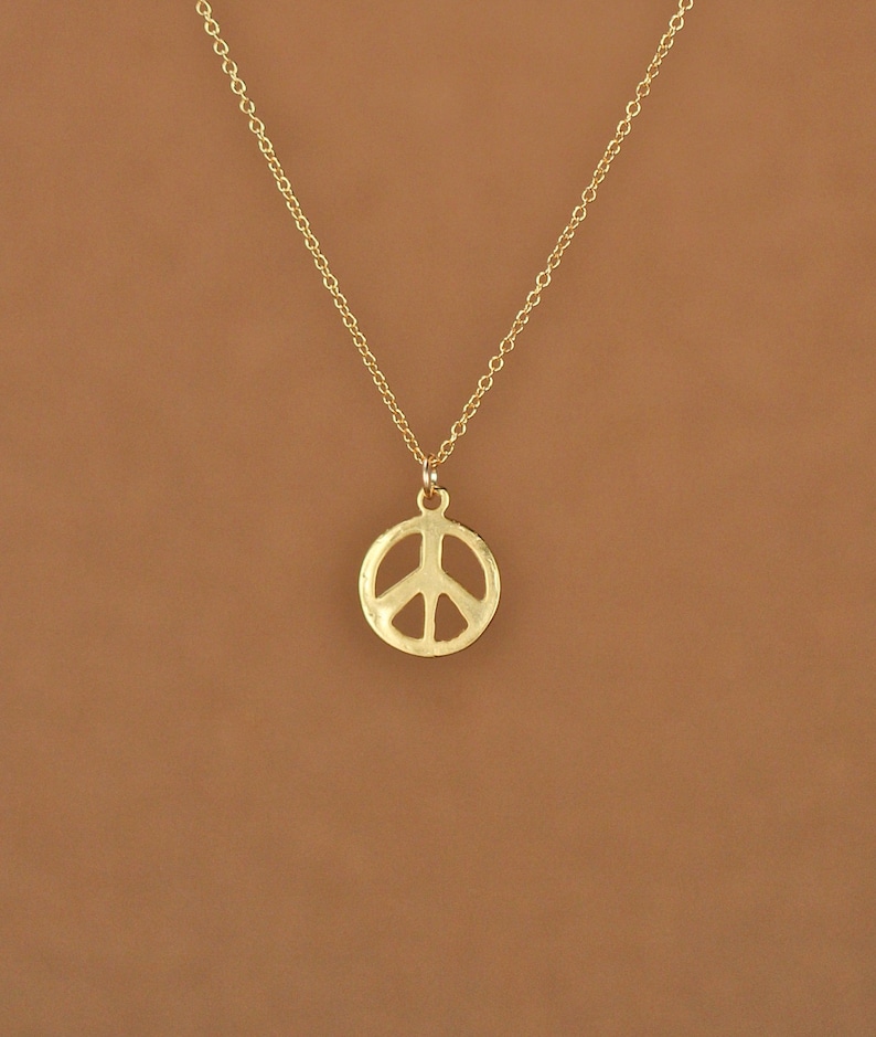 Gold peace sign necklace peace necklace delicate and dainty a 14k gold plated little gold peace symbol on a 14k gold filled chain image 1