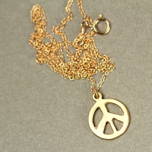 Gold peace sign necklace peace necklace delicate and dainty a 14k gold plated little gold peace symbol on a 14k gold filled chain image 2