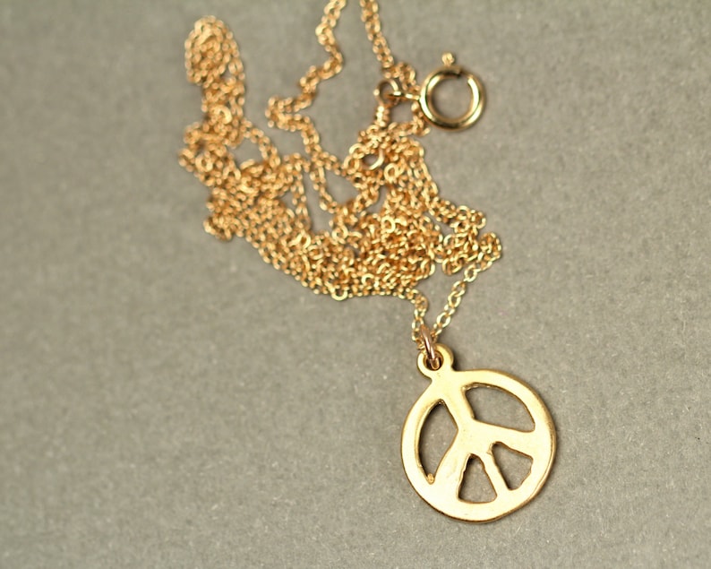 Gold peace sign necklace peace necklace delicate and dainty a 14k gold plated little gold peace symbol on a 14k gold filled chain image 2