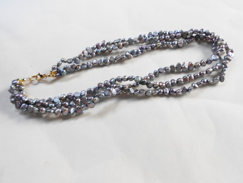 Vintage pebble necklace finished in abalone 3 strands of twisted tiny iridescent rocks