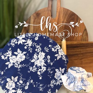 May include: A navy blue and white floral patterned bowl cover and a white and blue patterned jar cover. The image also shows a wooden cutting board and the text "Little Homemade Shop".