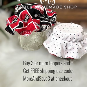 May include: Two fabric jar toppers. One is red, black and white with the words "Alabama" and "Roll Tide". The other is white with black polka dots. The text on the image reads "Buy 3 or more toppers and Get FREE shipping use code: MoreAndSave3 at checkout."