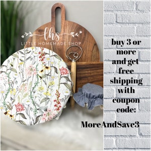 May include: A floral patterned fabric bowl cover with a wooden dough whisk and a wooden chopping board with the text "lhs LITTLE HOMEMADE SHOP". The text "buy 3 or more and get free shipping with coupon code: MoreAndSave3" is on a white brick background.