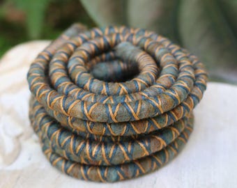SPIRALOCKS® The ORIGINAL bendable dreadlock tie Felt DAPPER. Handmade in Gunu village supporting families.