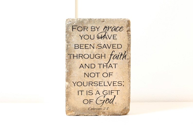 May include: A stone coaster with the Bible verse "For by grace you have been saved through faith, and that not of yourselves; it is a gift of God." Ephesians 2:8.
