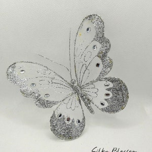 2 Gorgeous Silver glitter butterflies on clip with silver crystals hat and fascinator decorations dress pins floral arrangements decoration.