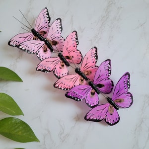 6 Assorted Monarch purple/Pink shaded Feather Butterflies on Clip for Cake toppers, home garden decoration, hat accent, floral, weddings