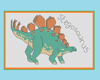 May include: Cross-stitch design of a Stegosaurus dinosaur in shades of teal, orange, and tan. The dinosaur is set against a white background with a teal border and the word "Stegosaurus" in black.