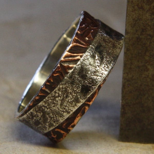 Two sides to every story. Mans ring of sterling silver and copper. Mans engagement ring.